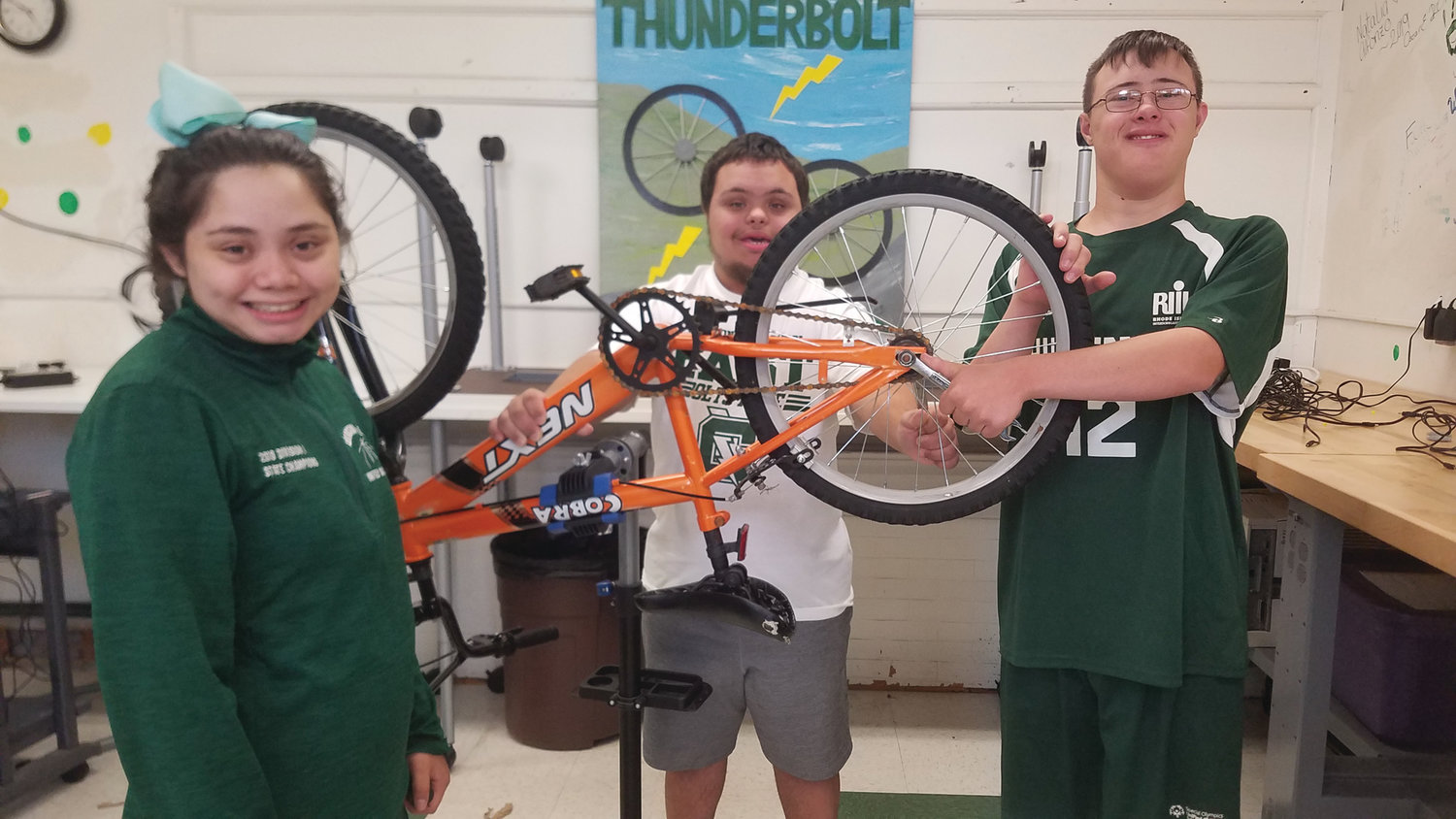 BIKE SHOP: Emily Sanita, James Hayden and Dylan Needham share a moment in Cranston East’s Thunderbolt Bike Shop.